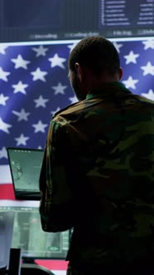 Military Professional Using Computers in Control Room