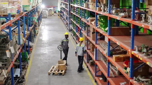 Warehouse Industrial and Logistics Companies. Dispatcher in uniform making inventory in storehouse.