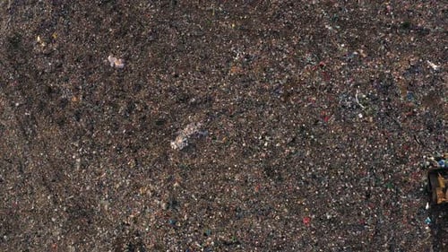 Top View of Bulldozer on a Garbage Dumb