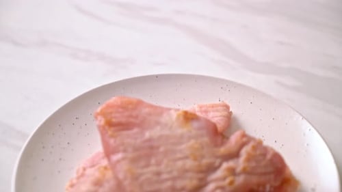Cooked pig's ears on a white dish