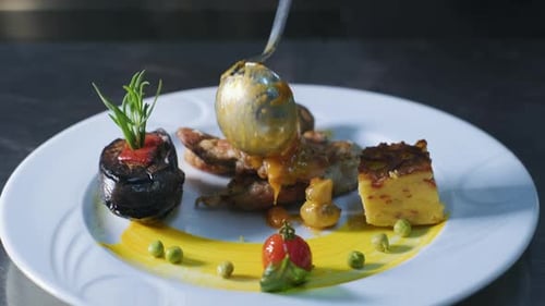 Close-up Professional Chef at Restaurant Kitchen Serves Dish Adding Final Ingredient by Hand. Prepar