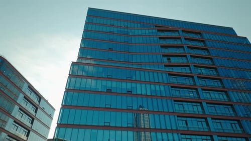 Commercial Building with Glass and Step Like Facades Structure Under Clear Sky Panorama Shot