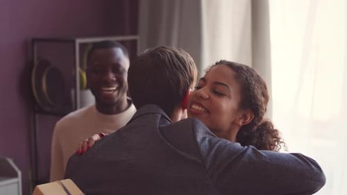 Group of Friends with Presents Getting Together in Apartment