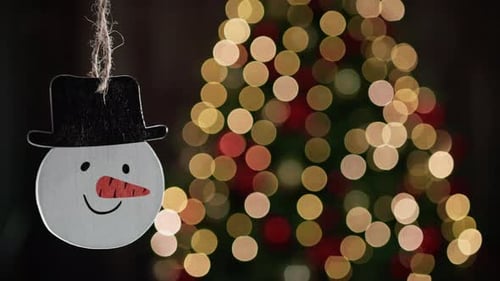 Festive Snowman Ornament with Christmas Lights Bokeh