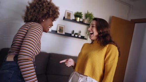 Two Female Friends Having Fun Together at Home Lesbian Couple Dancing and Enjoying Pride Day