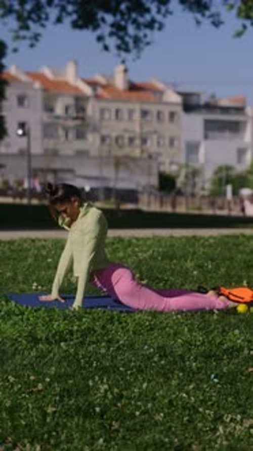 Engaging in Yoga Practice in a Park Promoting Flexibility Relaxation and Wellbeing