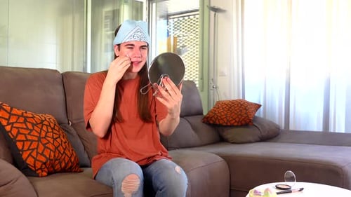 Young Adult Applying Makeup at Home in Daytime