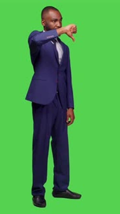 Vertical Video Side View of Negative Office Worker Doing Thumbs Down in Studio