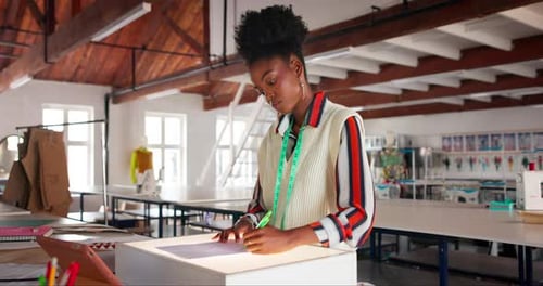 Fashion, designer and black woman drawing on paper with creative inspiration