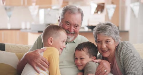 Grandparents Embrace Grandchildren with Love Indoors