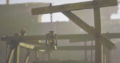 Vintage Oil Lamp Swaying in Dusty Environment
