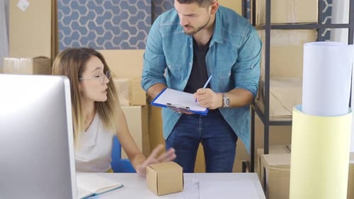 Online shopping. Young woman and man in e-commerce and delivery service concept.