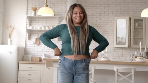 Woman Shows Off Loose Jeans After Weight Loss