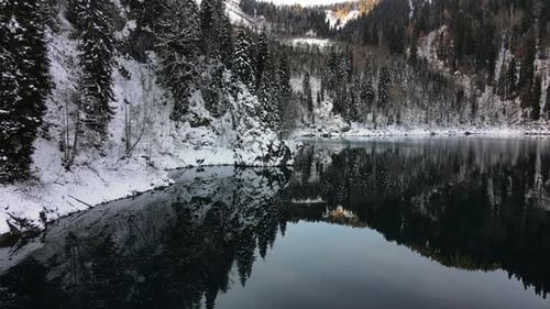 Icy Lake Cradled By Snowy Woods and Majestic Mountains Icy Lake Embodying Silent Majesty North Icy