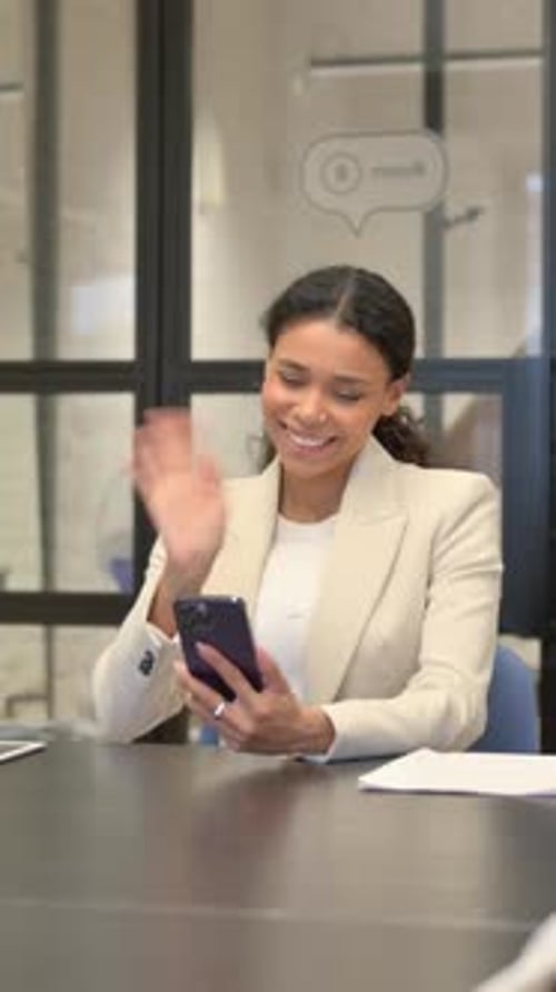 African Woman Doing Video Chat on Phone in Office, vertical video