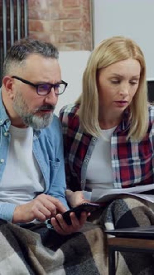 Front View of Likable Married Serious Experienced Bearded Man and His Wife Which Working with