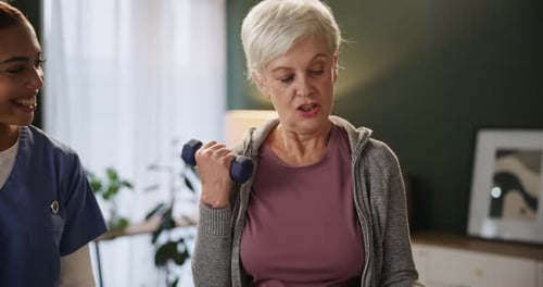 Senior Woman Exercising with Dumbbells Indoors