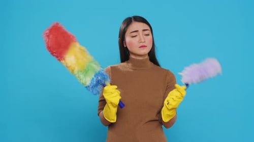 Woman Choosing Cleaning Duster for Housework and Chores