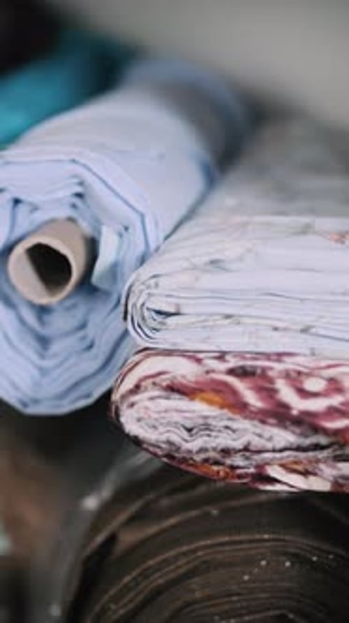 Rolls of Multicolored Fabric at Garment Factory