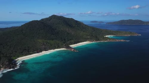 Aerial view over the island of La Digue in the Seychelles. Capturing the aqua blue water and beaches