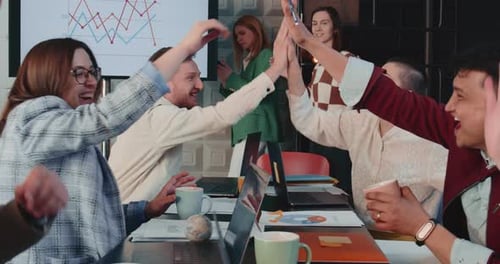 Happy Excited Team of Business People Start Up Partners Celebrate Success High Five at Office