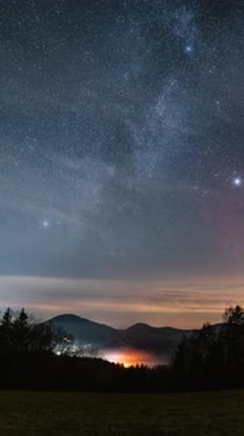 Milky Way Galaxy and Clouds Over Countryside