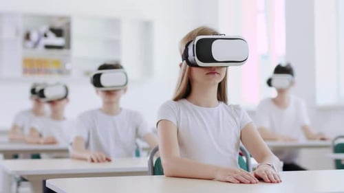 Students Wearing VR Headsets in a Classroom