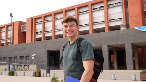 Happy University Student with a Backpack on Campus