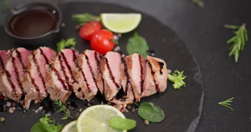 Sliced Medium-Rare Meat with Herbs and Tomatoes