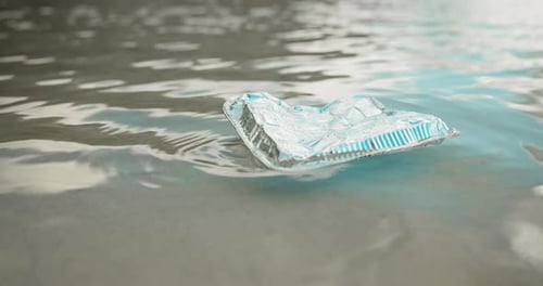 Water pollution, trash and container litter at beach for waste management fail
