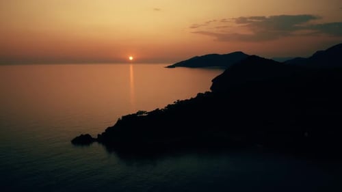 Breathtaking Scenery of Rocky Island and Sea Bay at Sunset