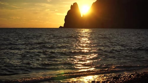 Sunset Over Sea Landscape with Yachts and Rocky Coastline Yachts in the Sea on a Background of Rocky