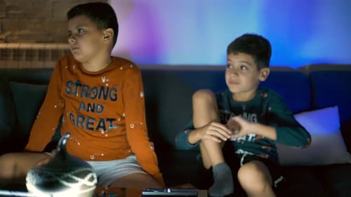 Boys Watching Television at Home at Night