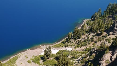 Aerial Panorama of Crater Lake Verdant Forested Shoreline in Oregon