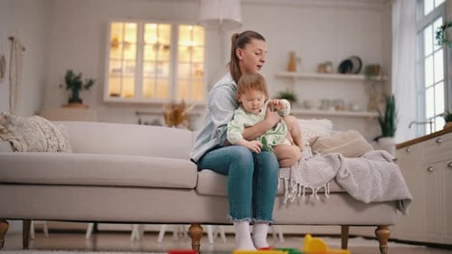 Woman Bonding With Adorable Toddler At Home