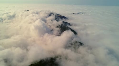 Dense Clouds Creeping Over Slanted Plateau