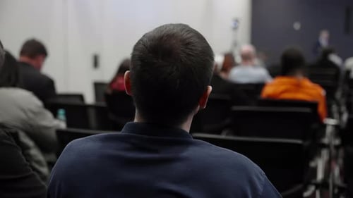 Audience Listening to a Speaker at a Conference