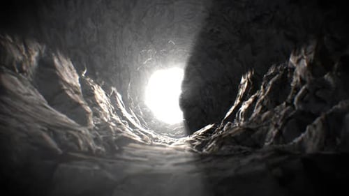 Dark Rocky Tunnel Fly-Through With Bright Light Reveal