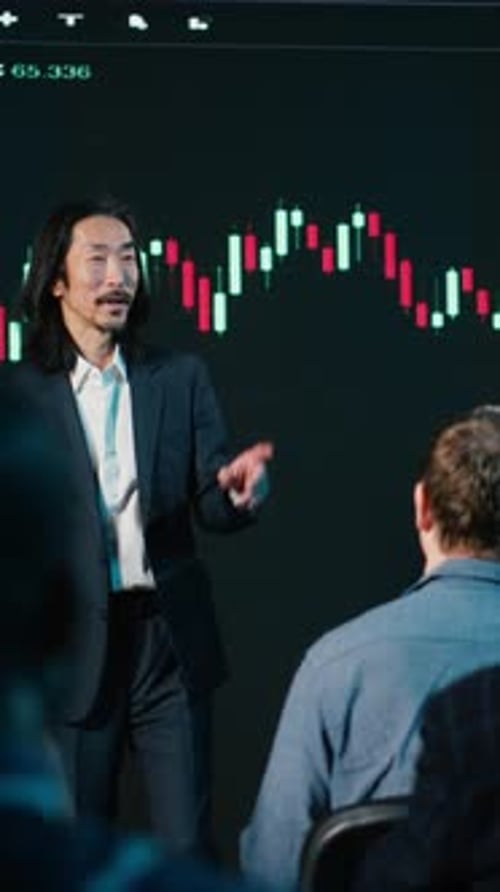 Vertical Video Asian and Black Brokers Hosting Trading Presentation with Market Shares