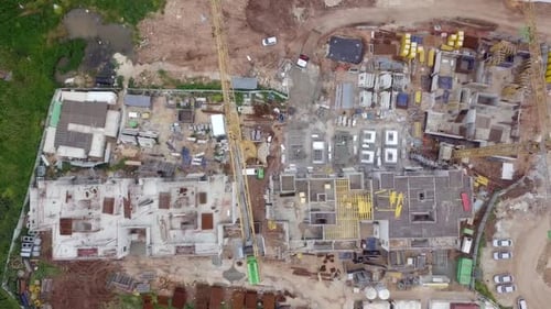 Large residential construction site with cranes, Aerial view