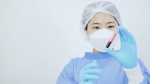 Healthcare Worker Holds Blood Test Tube