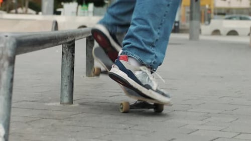 Young Skater Making 360 Flip Jump Performing Kickflip Trick Skateboarder Training in Skatepark