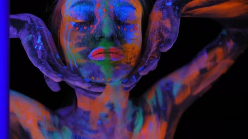 A Girl's Face with an Ultraviolet Pattern in the Light of a Fluorescent Lamp