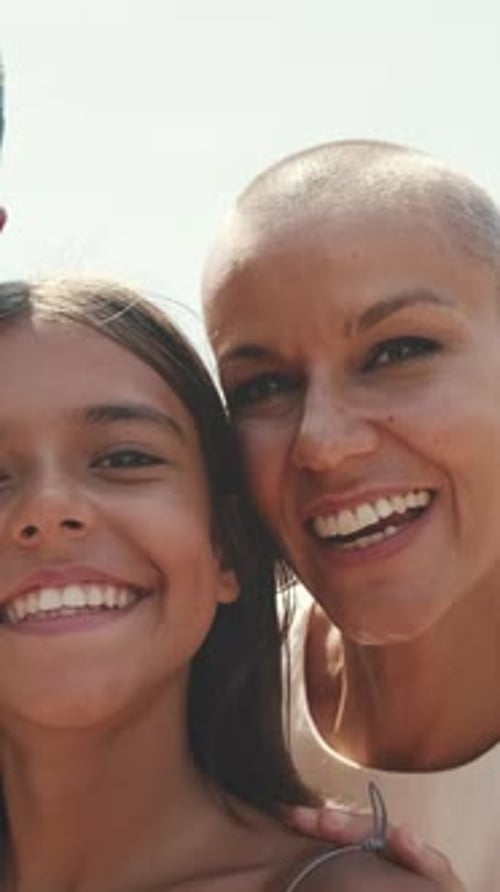 Happy young family of three smiling while spending time together