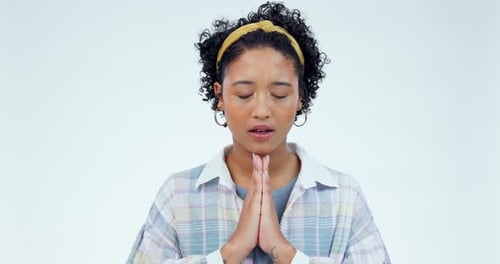Praying, hands and woman in studio for worship, thank you and gratitude to God against white