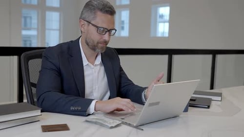 Middle Aged Businessman Working with Laptop in Office Hispanic Business Man Using Laptop Millennial