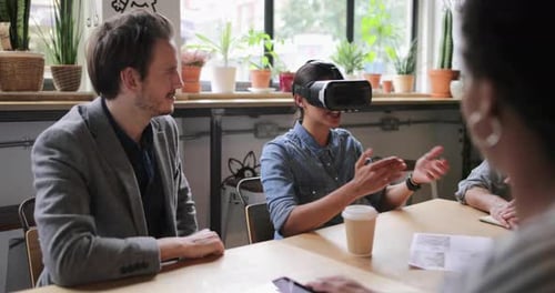 Group of People Discussing Virtual Reality Headset