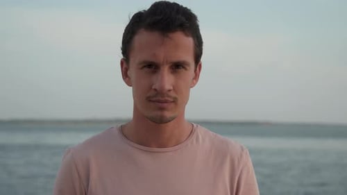 Young Man Posing Outdoors Near Ocean