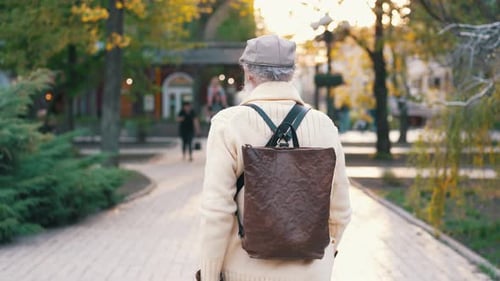 Back of an Senior Man Walking at City