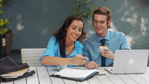 Two People Having a Business Meeting at Cafe